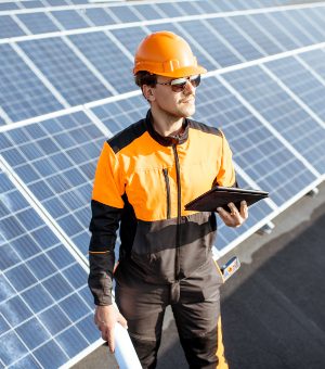 engineer-servicing-solar-panels-on-electric-plant-DAQKVRP.jpg